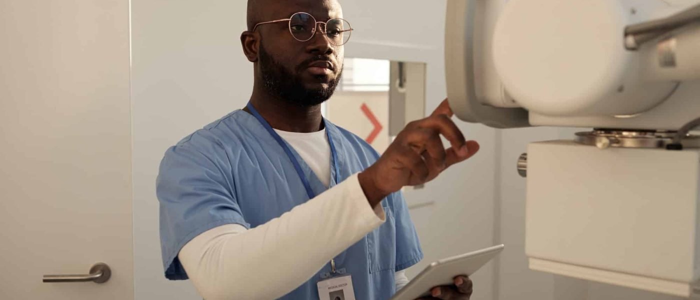 serious-african-american-male-clinician-preparing-for-examination-of-patient.jpg
